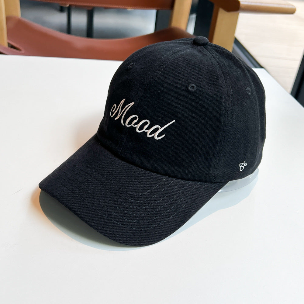 Kvinnenes broderte statement caps Skanto