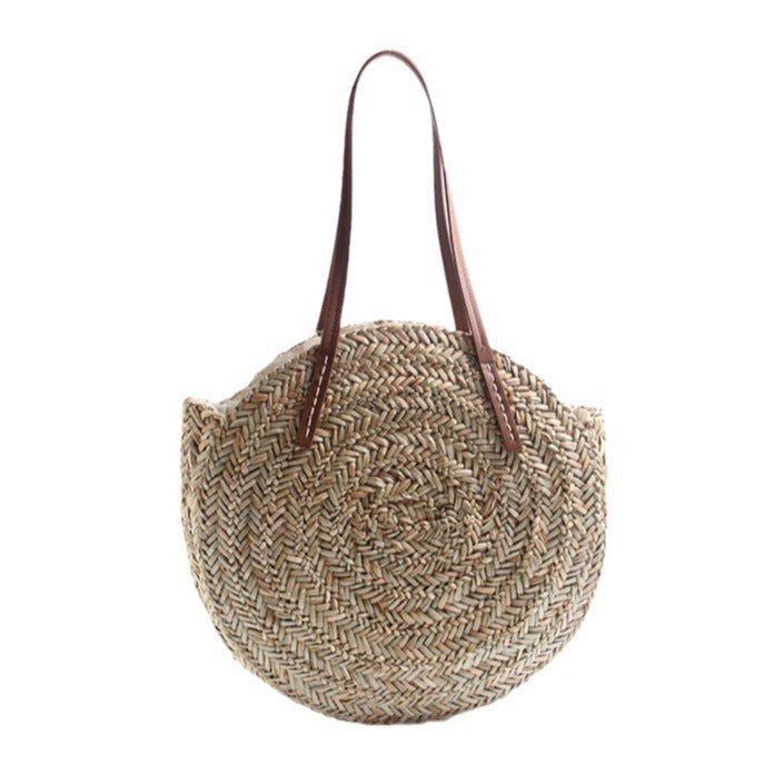 Braided straw beach bag with elegant leather handles Skanto