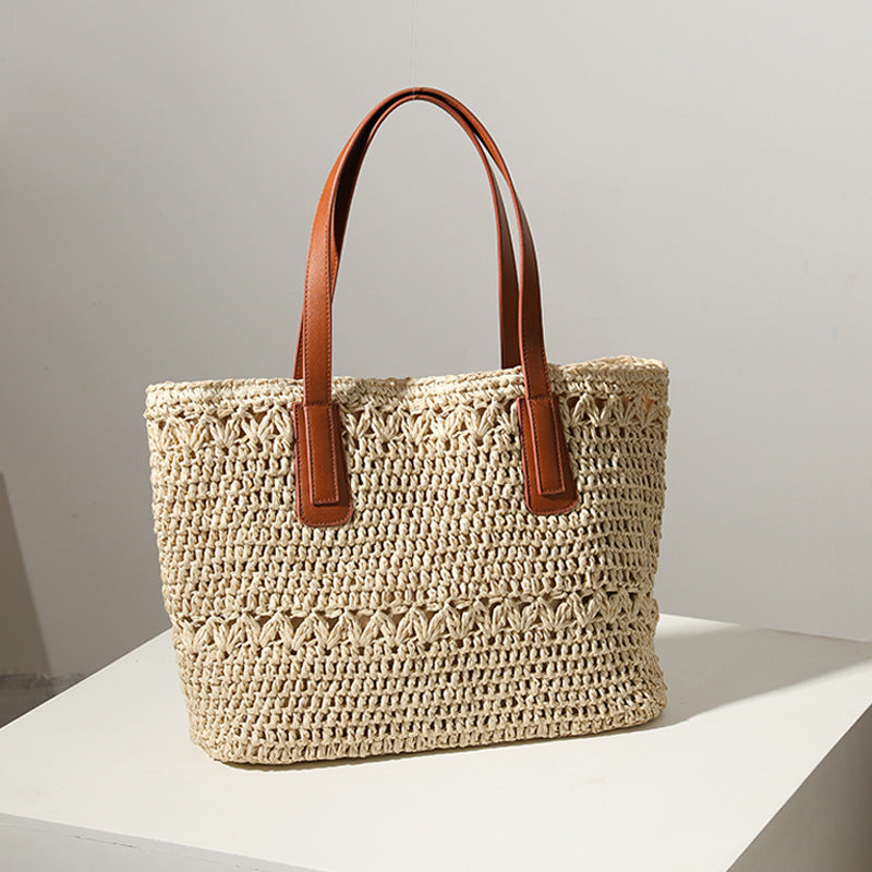Braided straw basket with sturdy leather handles Skanto