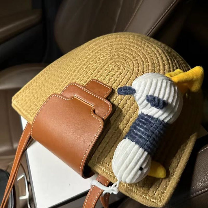 Modern tote bag made of woven material with playful pendant Skanto
