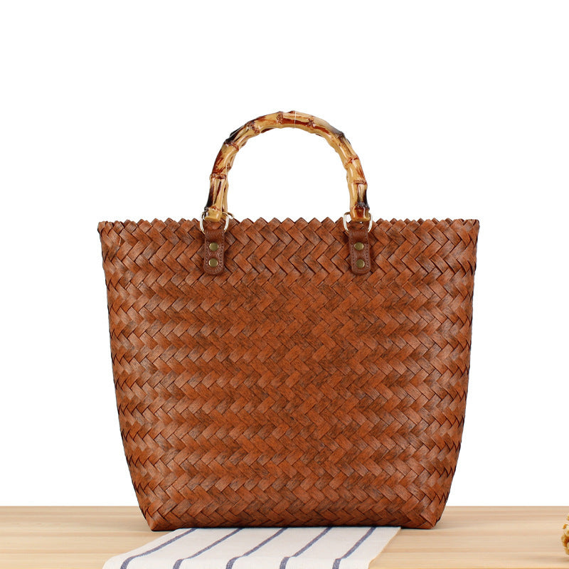 Handbag made of high-quality, braided material with bamboo handle Skanto
