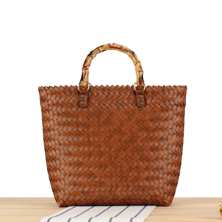 Handbag made of high-quality, braided material with bamboo handle Skanto