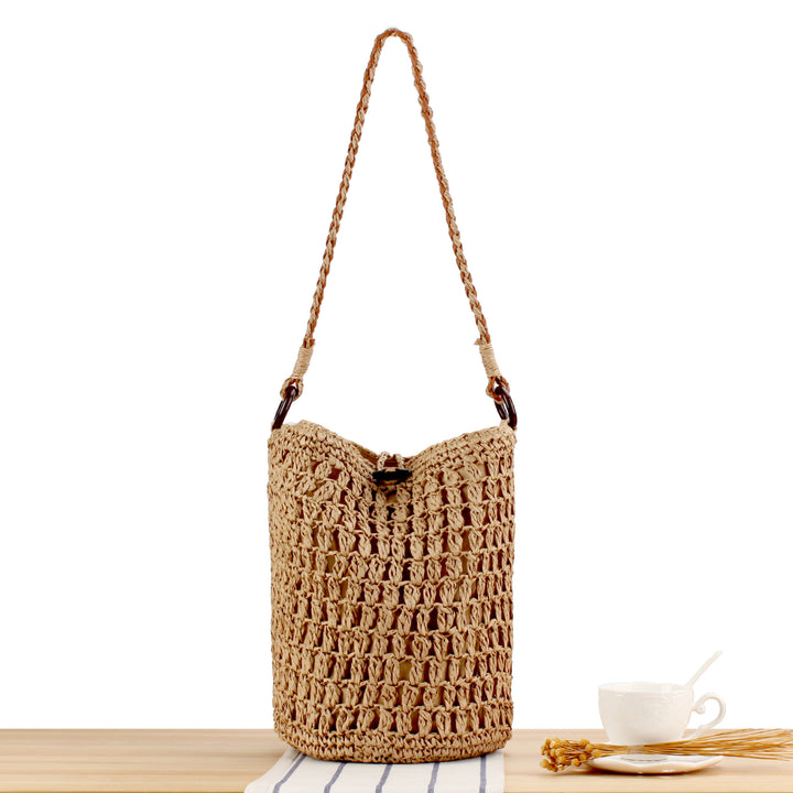 Handbag made of hand-woven natural material with decorative clasp Skanto