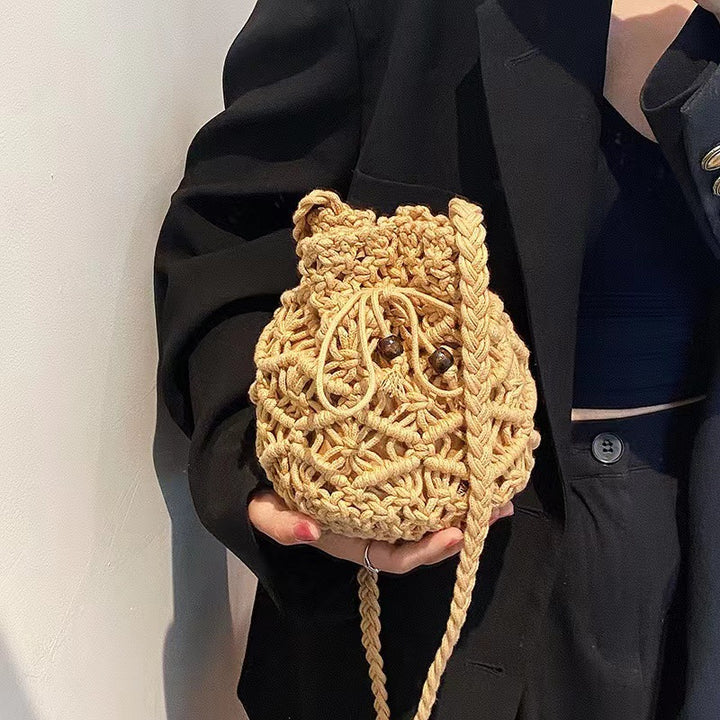 Hand-knotted shoulder bag with playful animal motif Skanto