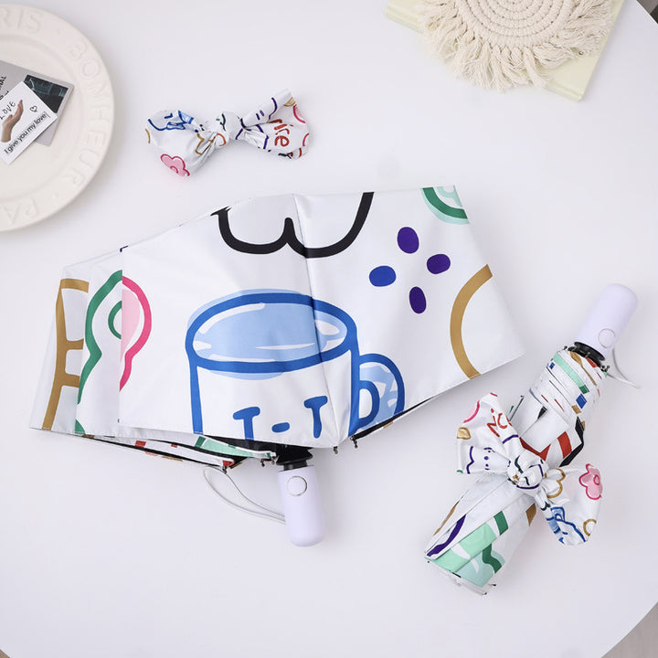Damer kreativ sammenleggbart paraply med fargerike motiver Skanto
