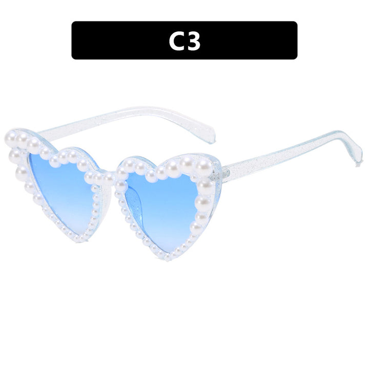 Dame hjerteformet solbrille med perlebesatt ramme Skanto