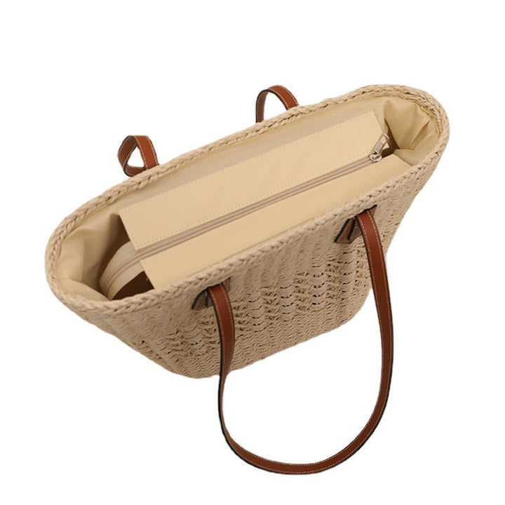 Handmade rattan basket bag with elegant leather details Skanto