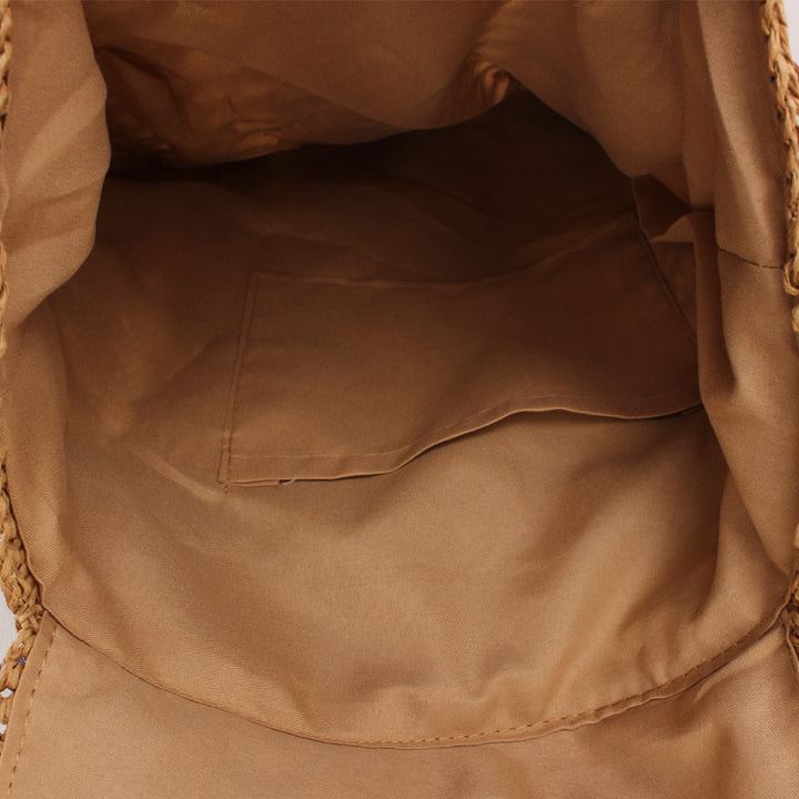 Backpack made of natural raffia with leather details Skanto