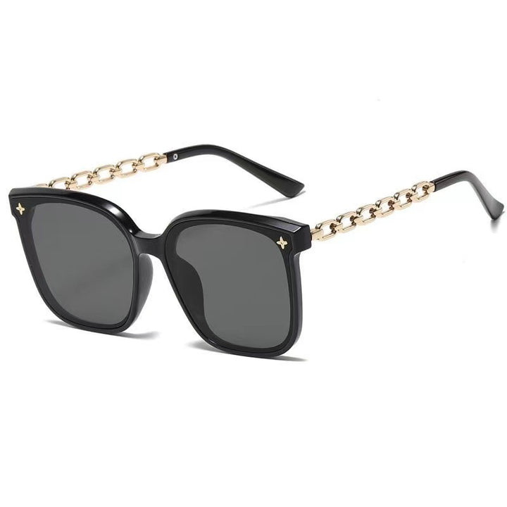 Dame ekstrastor solbrille med modig kjedeinnramming Skanto