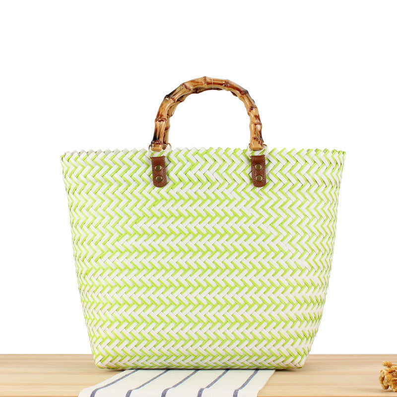 Handbag made of high-quality, braided material with bamboo handle Skanto