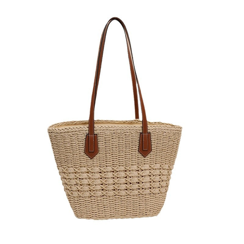 Handmade rattan basket bag with elegant leather details Skanto