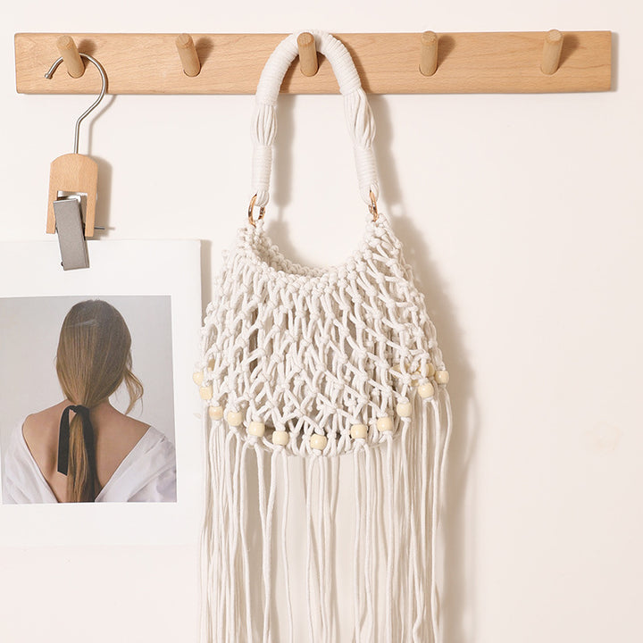 Macrame bag with decorative fringes and wooden beads Skanto
