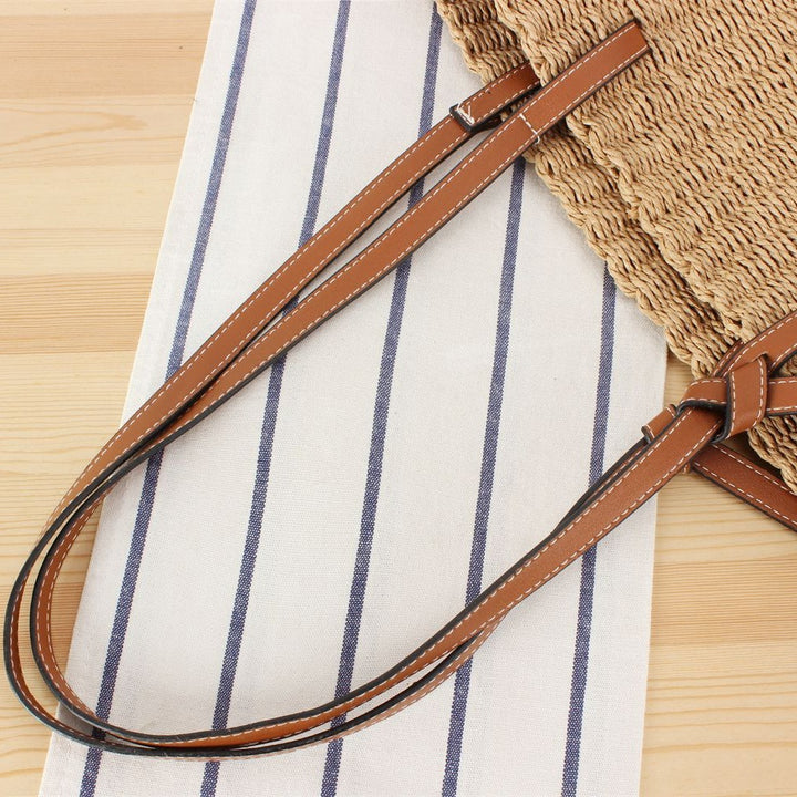 Beach bag made of hand-woven natural material with sturdy leather straps Skanto