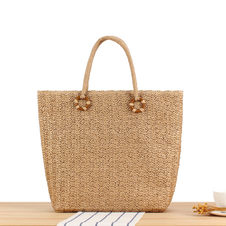 Beach bag in natural woven material with sturdy handles Skanto