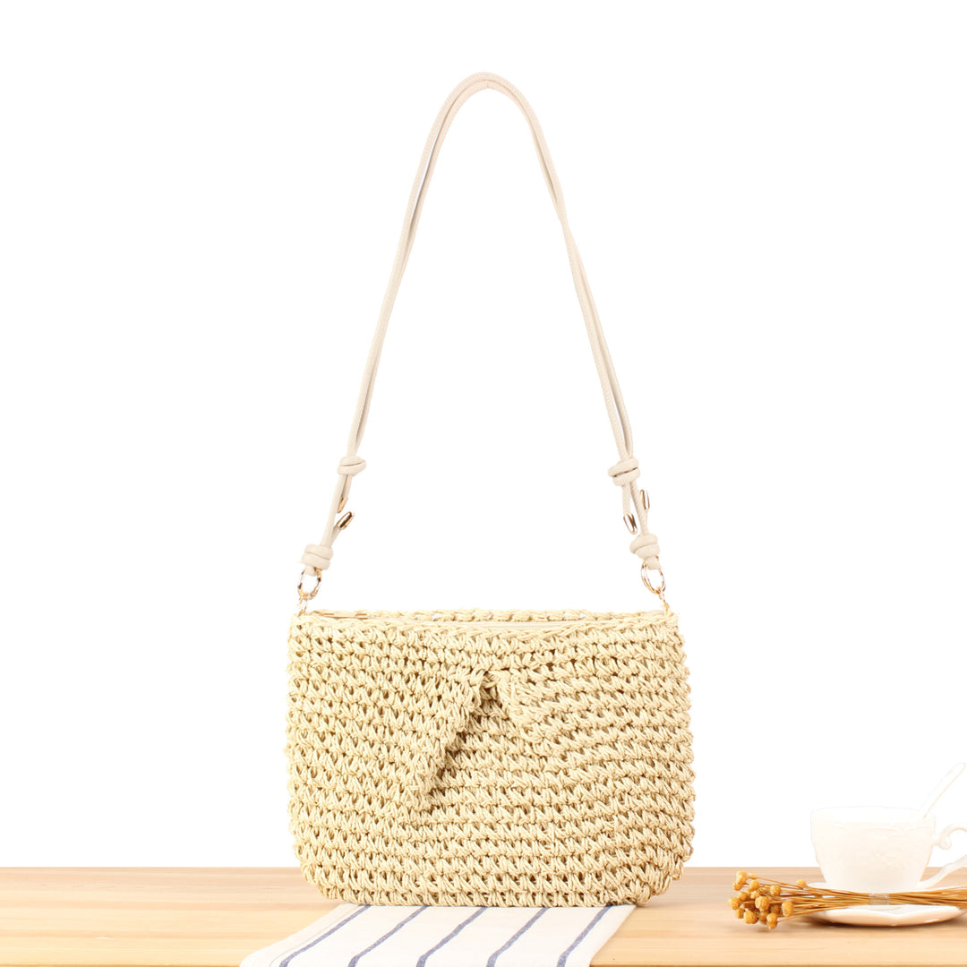 Handbag made of braided natural material with elegant button closure Skanto