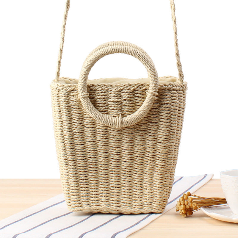 Woven natural material handbag with round handle Skanto