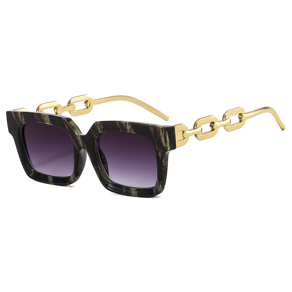 Dame moterik kvadratisk solbrille med luksuriøse kjededetaljer Skanto