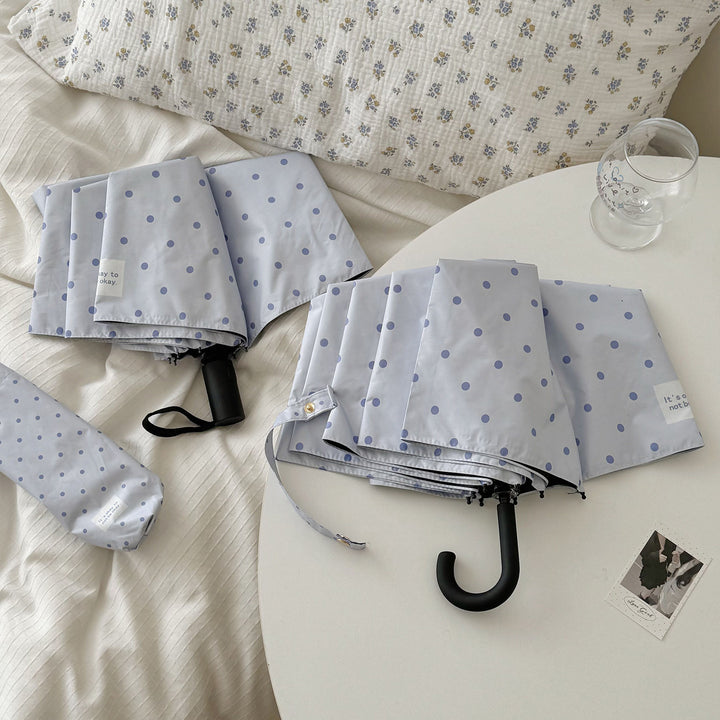 DameFaltparaply med robust mekanisme og stillegant design Skanto