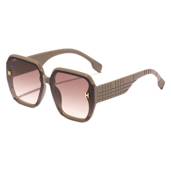 Damer moteriktig solbrille med kvadratisk ramme og trendy glass Skanto