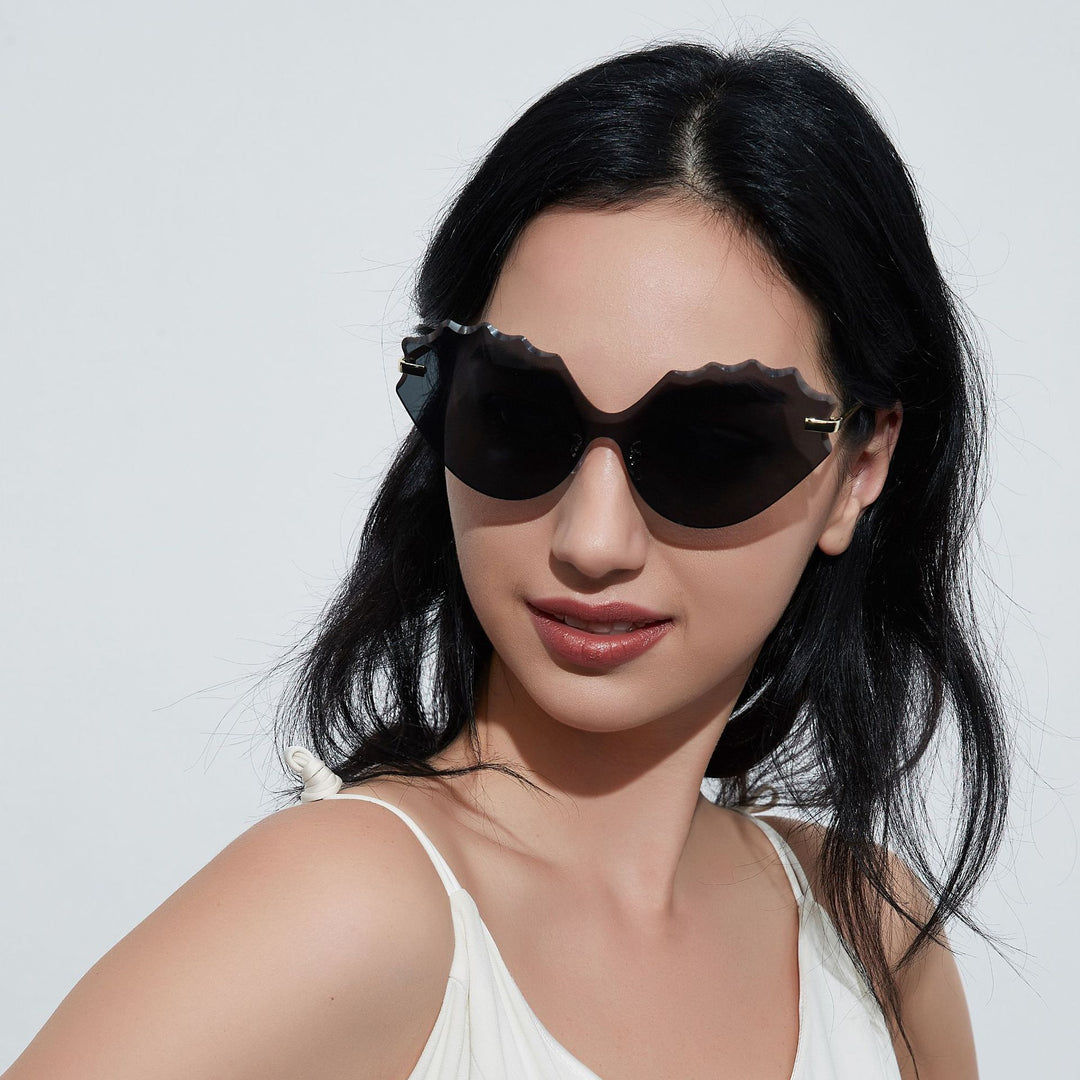 Dame solbrille med unik bølgedesign Skanto