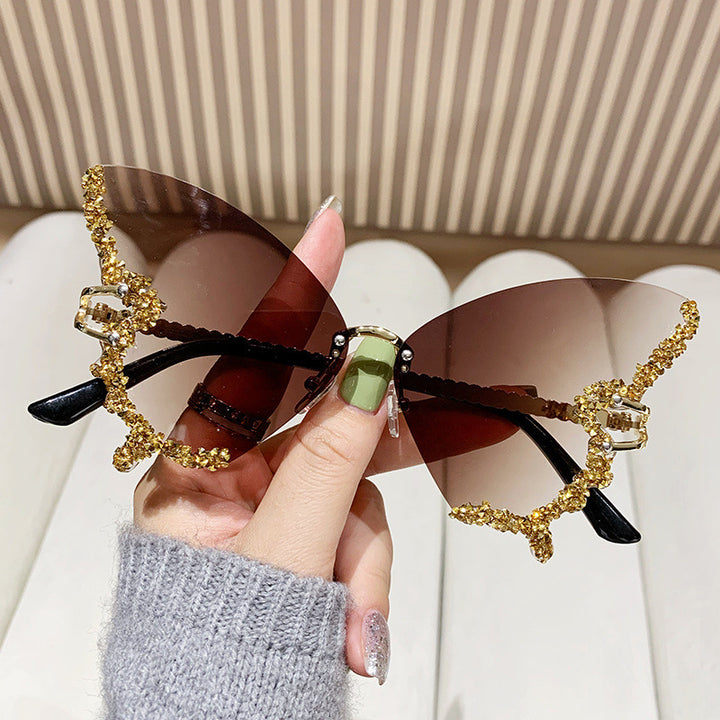 Dame ekstravagante solbriller med glitrende sommerfugl-design Skanto