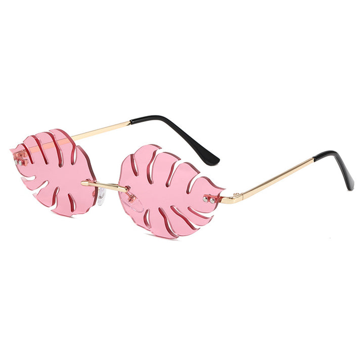 Dama moteriktig solbrille med markant bladerdesign Skanto