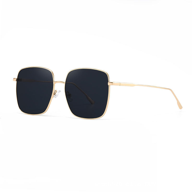 Dame solbrille med moderne firkantet rustfritt stålramme og polarisert glass Skanto
