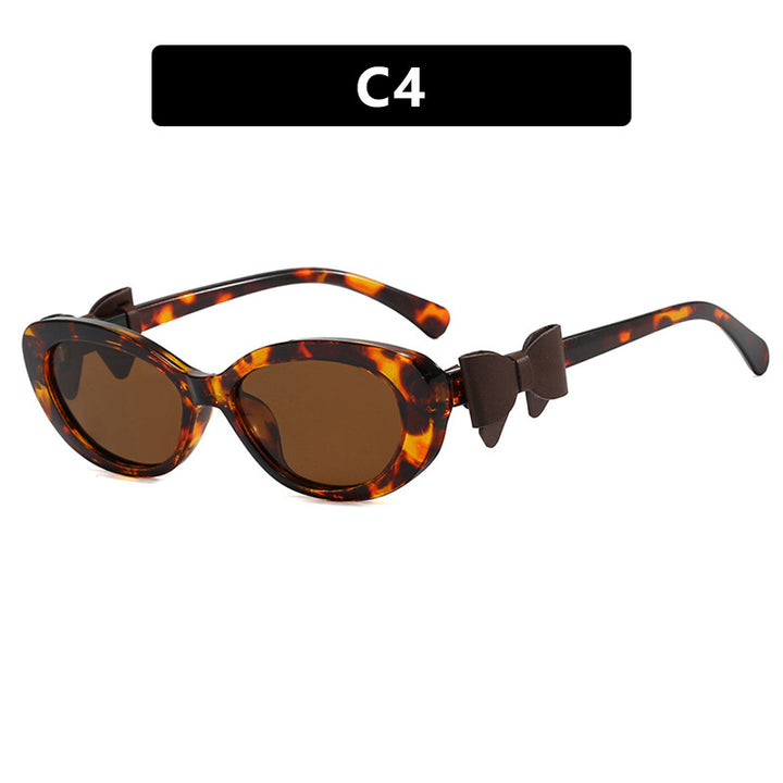 Dame moteriktig solbrille med lekent sløyfedesign Skanto