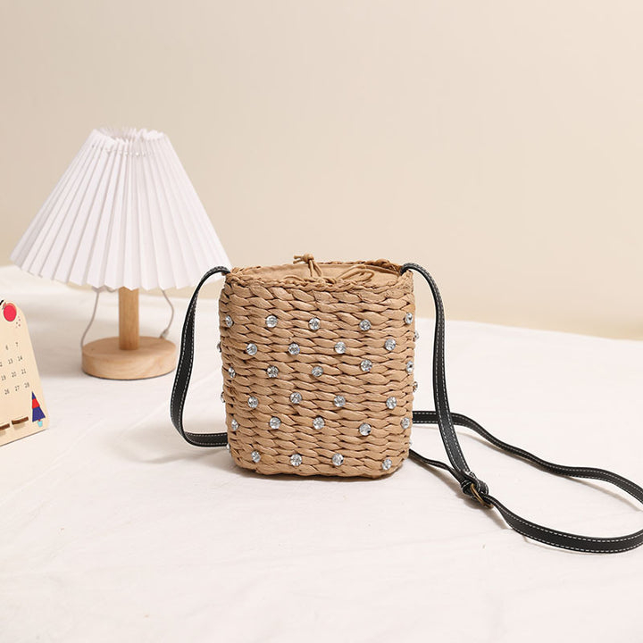 Woven natural material handbag with sparkling applications Skanto