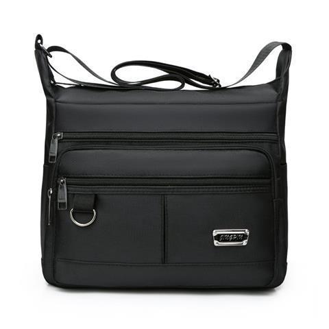 Praktisk crossbody-veske med multifunksjonelt fagssystem Skanto