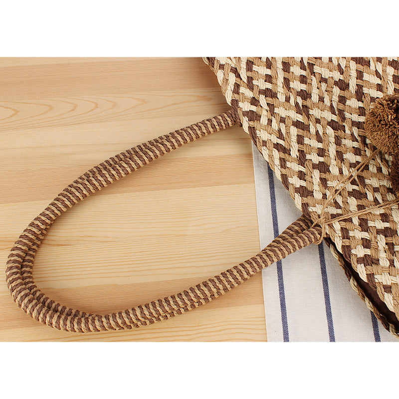 Modern basket bag with decorative pom poms Skanto