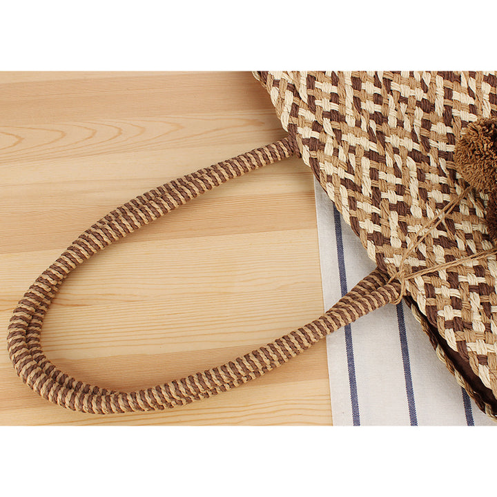 Modern basket bag with decorative pom poms Skanto