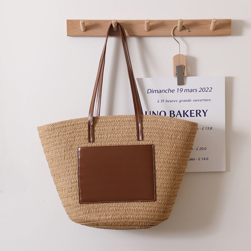 Elegant straw bag with stylish leather details Skanto