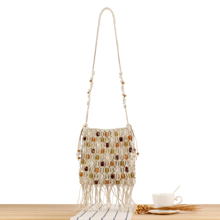 Handmade shoulder bag with decorative beads and fringes Skanto