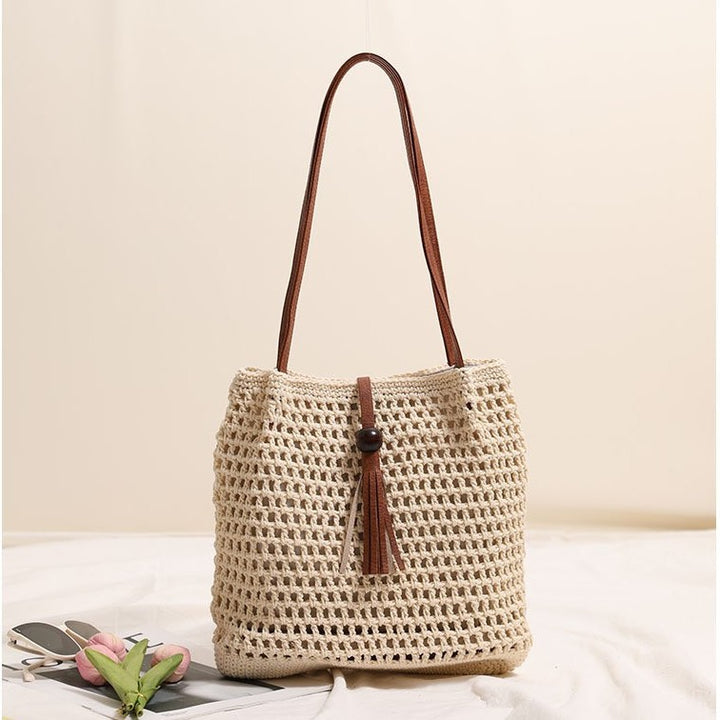 Hand-knotted basket bag with elegant leather handle Skanto