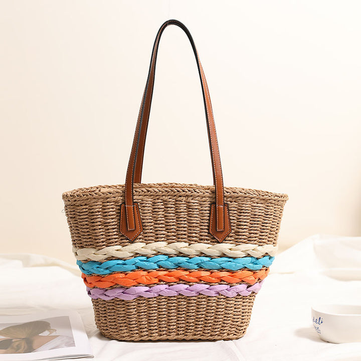 Basket-style straw bag with colorful braided accents Skanto