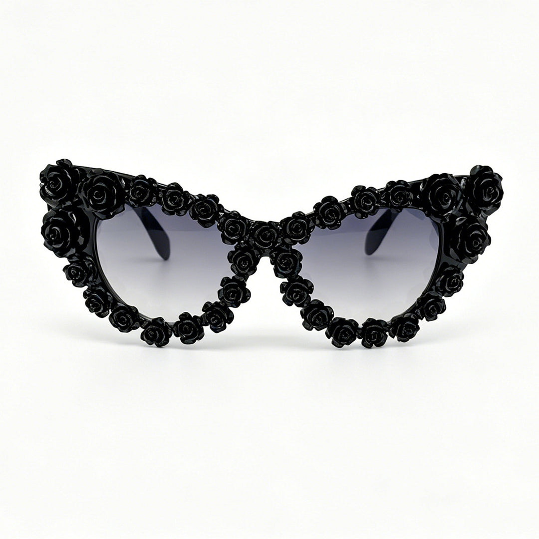 Damen hjerteformet solbrille med blomsterapplikasjon Skanto