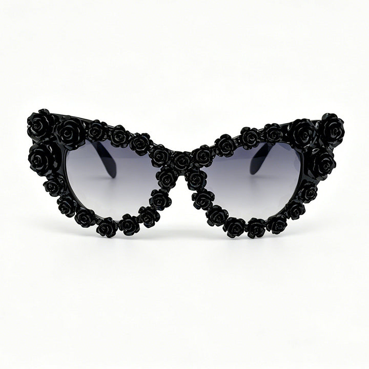 Damen hjerteformet solbrille med blomsterapplikasjon Skanto