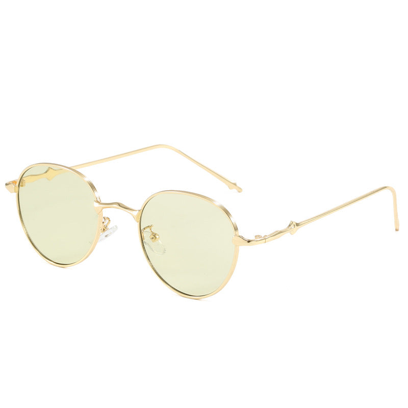 Dame elegante runde solbriller med moderne metallramme Skanto