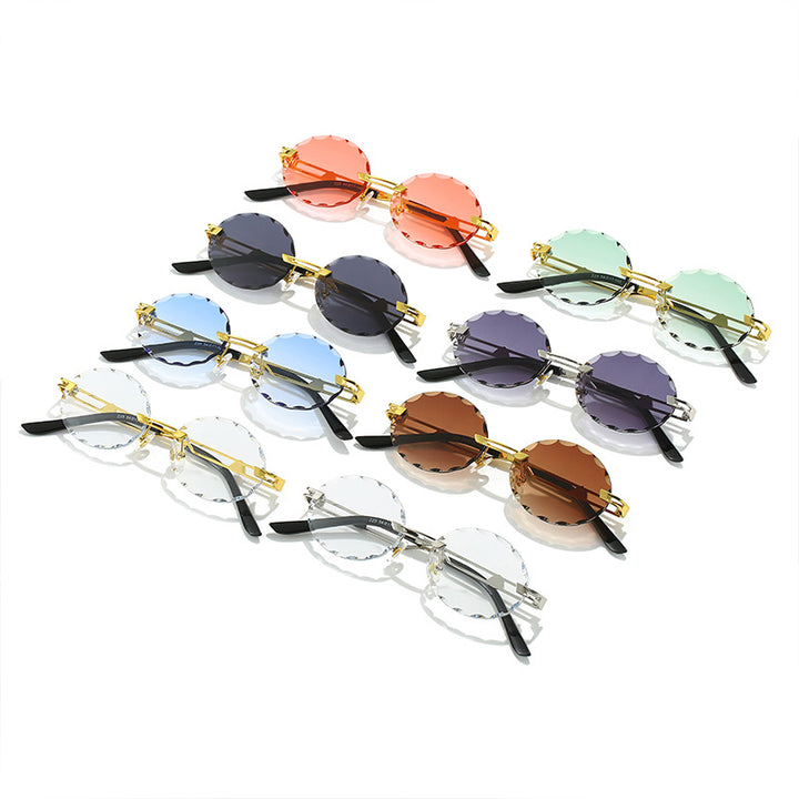 Dame rund solbrille med unikt bølgedesign og høykvalitets metallramme Skanto