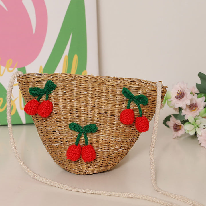 Playful straw shoulder bag with floral accents Skanto