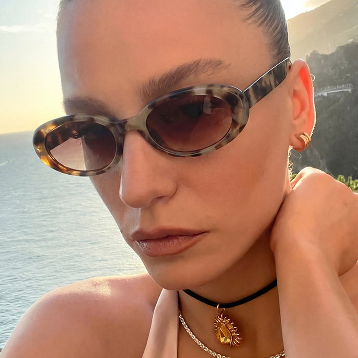 Women's oval sunglasses with transparent effect and UV protection Skanto