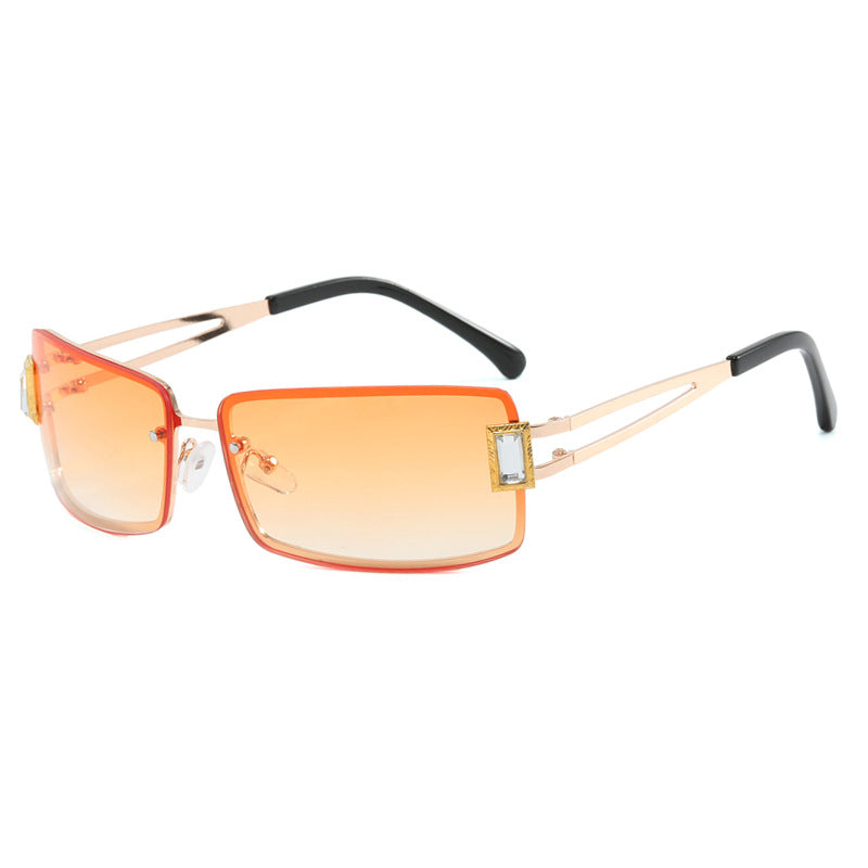Stylish women's sunglasses with elegant trapezoidal lenses and filigree metal frame Skanto