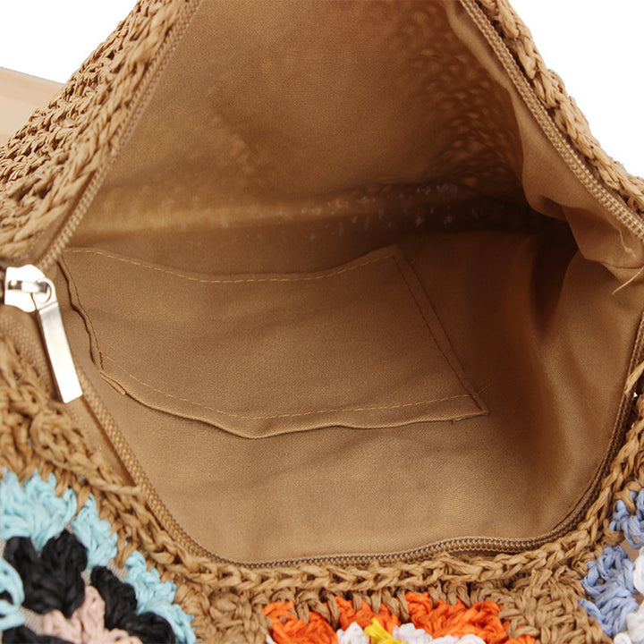 Hand-knotted shoulder bag with colorful floral design Skanto
