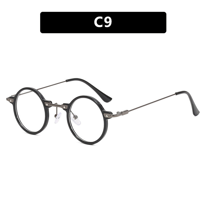 Dame rund solbrille med moderne metallramme og store blå linser Skanto