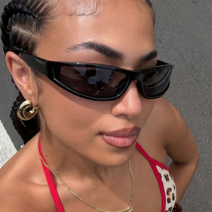 Women's sports sunglasses with a flat, aerodynamic design and UV protection Skanto