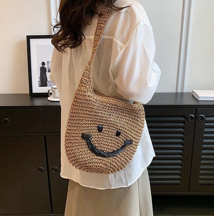 Håndveske med smilende motiv Skanto
