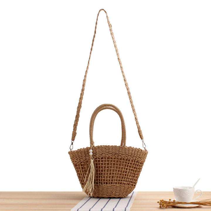 Handbag made of braided natural material with elegant fringe detail Skanto