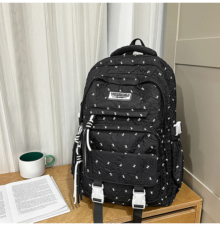 Multi-roms quiltet skole ryggsekk
