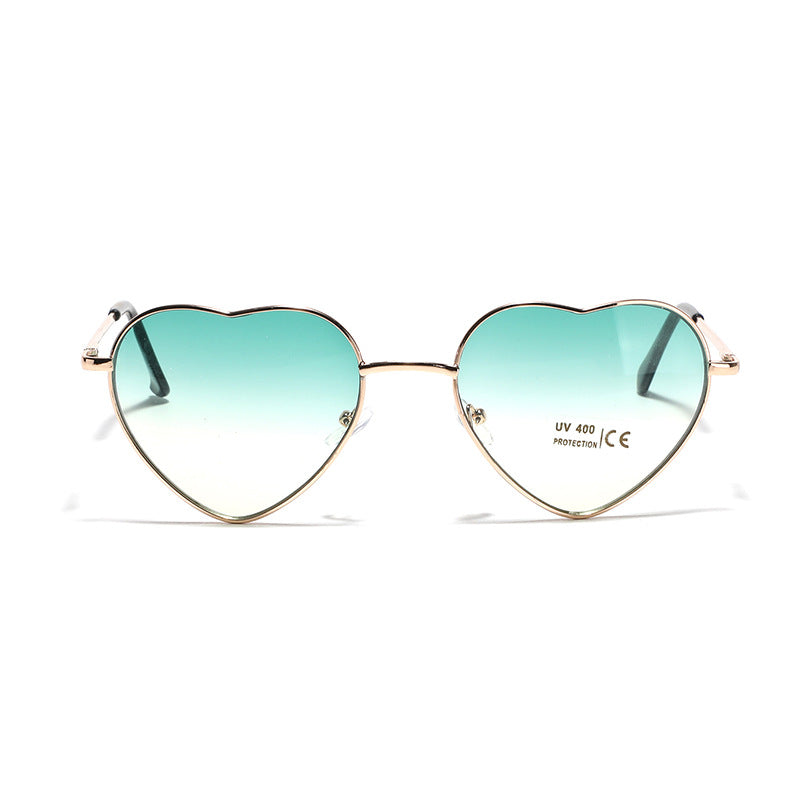 Dame hjerteformet solbrille med UV-beskyttelse og delikat ramme Skanto